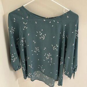 Green blouse with foliage pattern